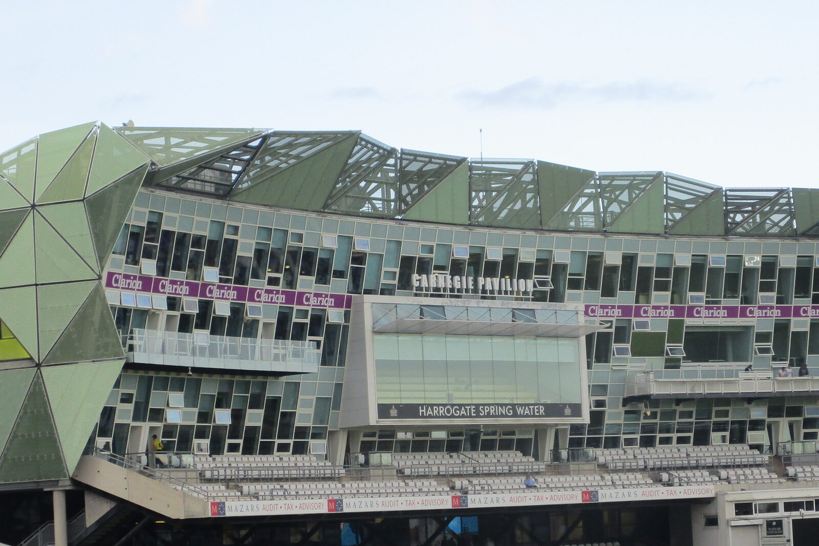 The geometric green facade and cricket-facing balconies of Headingley’s Pavilion.