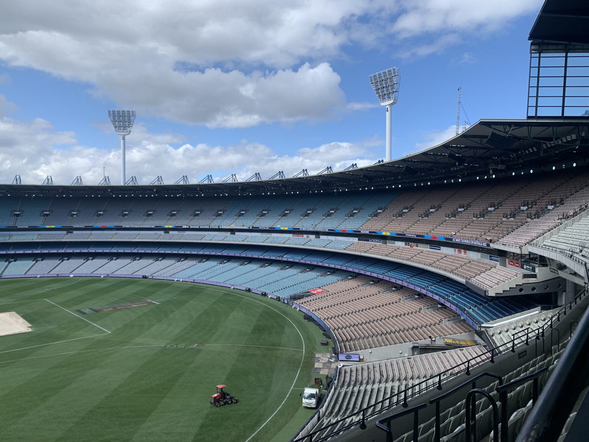 Empty seating tiers of the Shane Warne Stand above the MCG playing field
