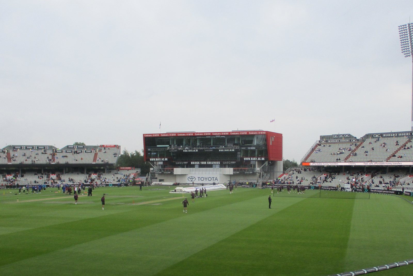 The outfield at Emirates Old Trafford during the July 2025 Test, with the modern Media Centre and adjoining spectator stands
